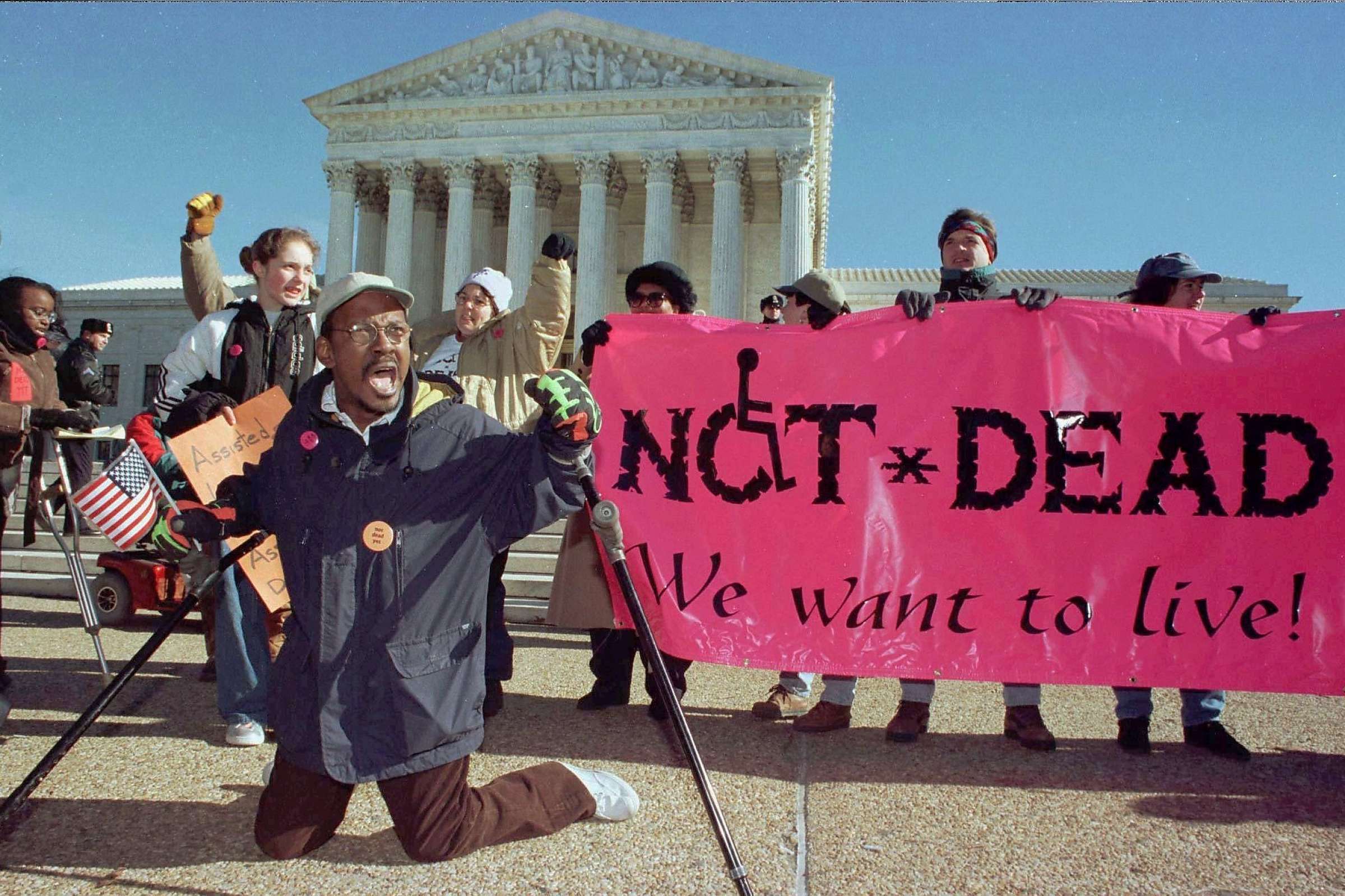 Gregory Dugan of Washington D.C. (L) leads a group of protesters against doctor assisted suicide.
