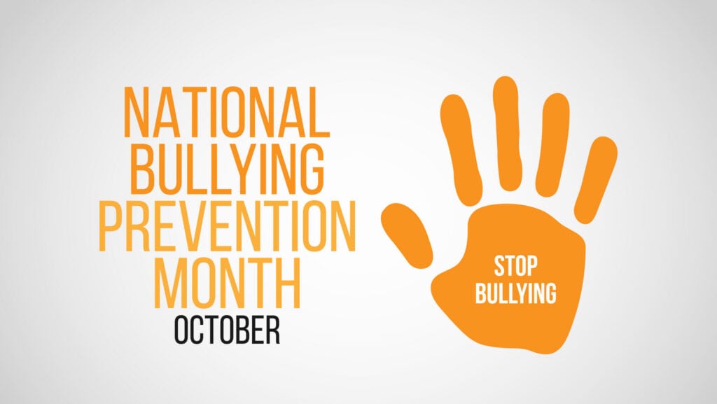 Orange hand with 'Stop Bullying' message for National Bullying Prevention Month.