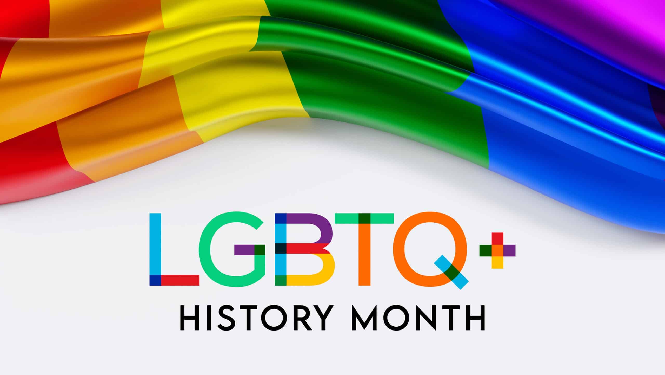 LGBTQ+ rainbow flag with 'LGBTQ+ History Month' text on a white background.