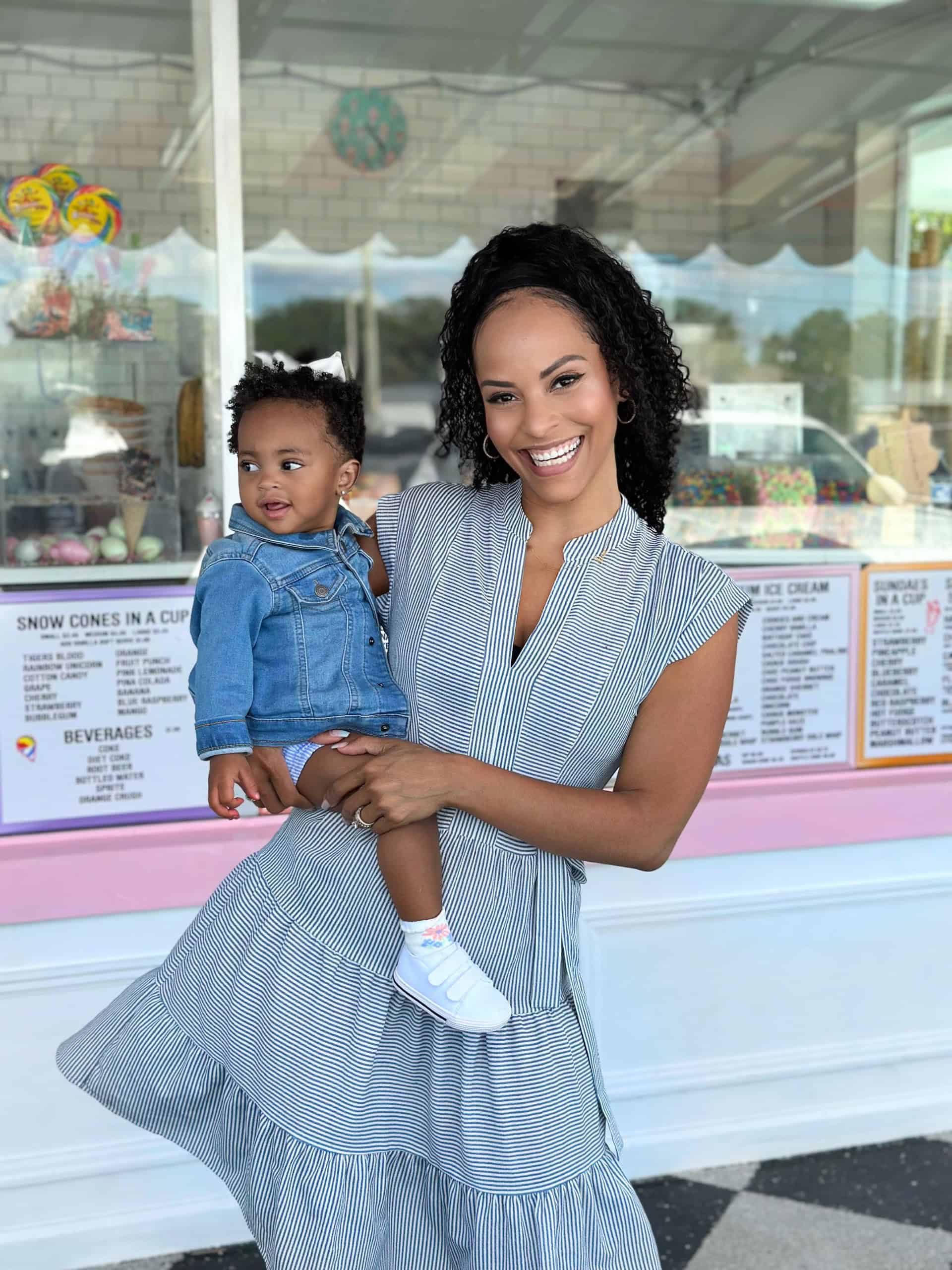 Alicia holding Journi outside an ice cream shop